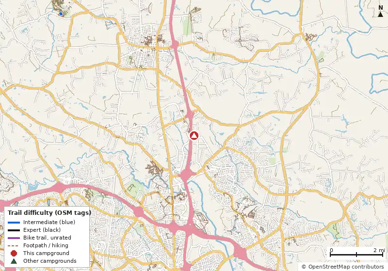 Map of roads, water and trails within about 5 miles of Americamps RV Resort, with bike trails colored by their OpenStreetMap difficulty tags