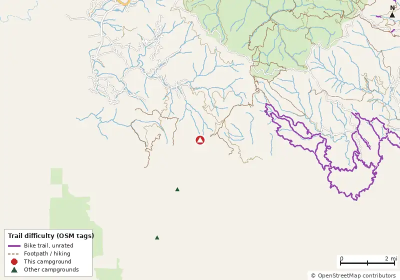 Map of roads, water and trails within about 5 miles of Amicalola Mountain, with bike trails colored by their OpenStreetMap difficulty tags