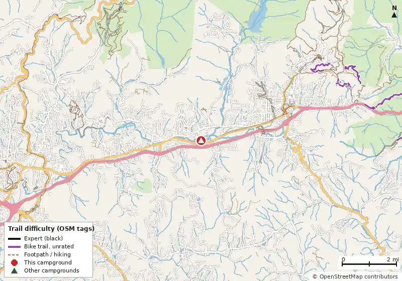 Map of roads, water and trails within about 5 miles of Asheville East KOA Holiday, with bike trails colored by their OpenStreetMap difficulty tags