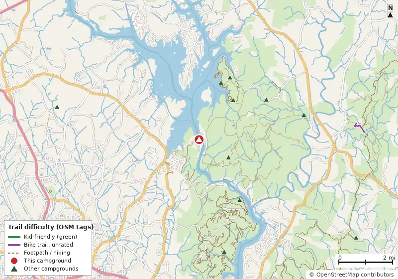 Map of roads, water and trails within about 5 miles of Badin Narrows Dam Portage Campground, with bike trails colored by their OpenStreetMap difficulty tags