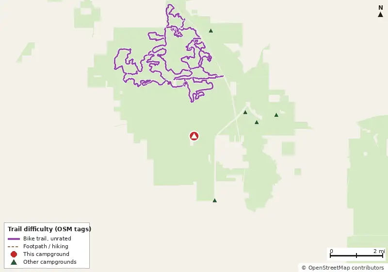 Map of roads, water and trails within about 5 miles of Buttgenbach Campground at Croom Motorcycle area, with bike trails colored by their OpenStreetMap difficulty tags