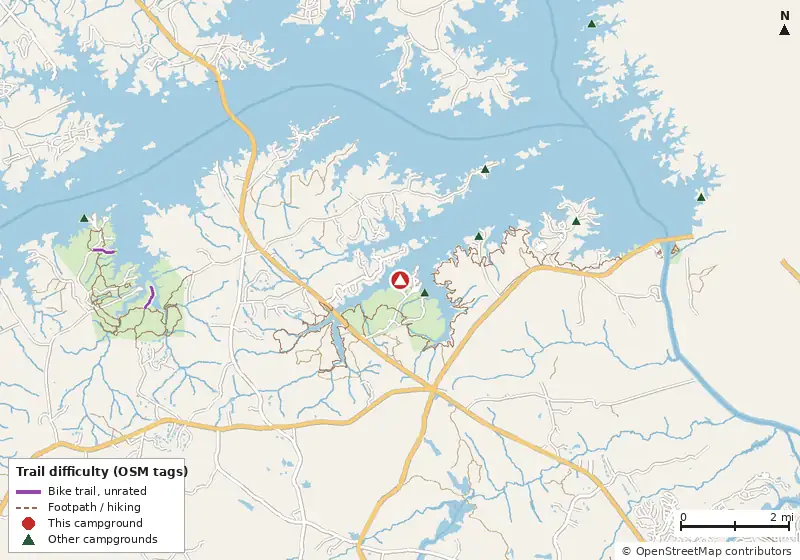 Map of roads, water and trails within about 5 miles of Camping Municipal, with bike trails colored by their OpenStreetMap difficulty tags
