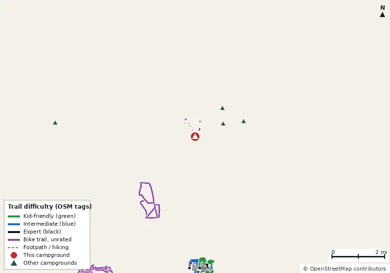 Map of roads, water and trails within about 5 miles of Campsite 1, with bike trails colored by their OpenStreetMap difficulty tags