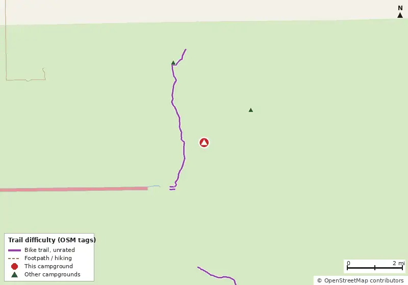 Map of roads, water and trails within about 5 miles of Carpenter Camp, with bike trails colored by their OpenStreetMap difficulty tags