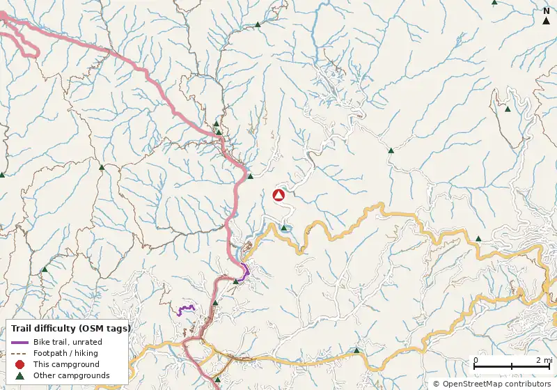 Map of roads, water and trails within about 5 miles of Cherokee / Great Smokies KOA Holiday, with bike trails colored by their OpenStreetMap difficulty tags