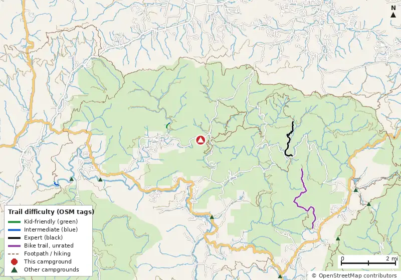 Map of roads, water and trails within about 5 miles of Cooper Creek Campground, with bike trails colored by their OpenStreetMap difficulty tags