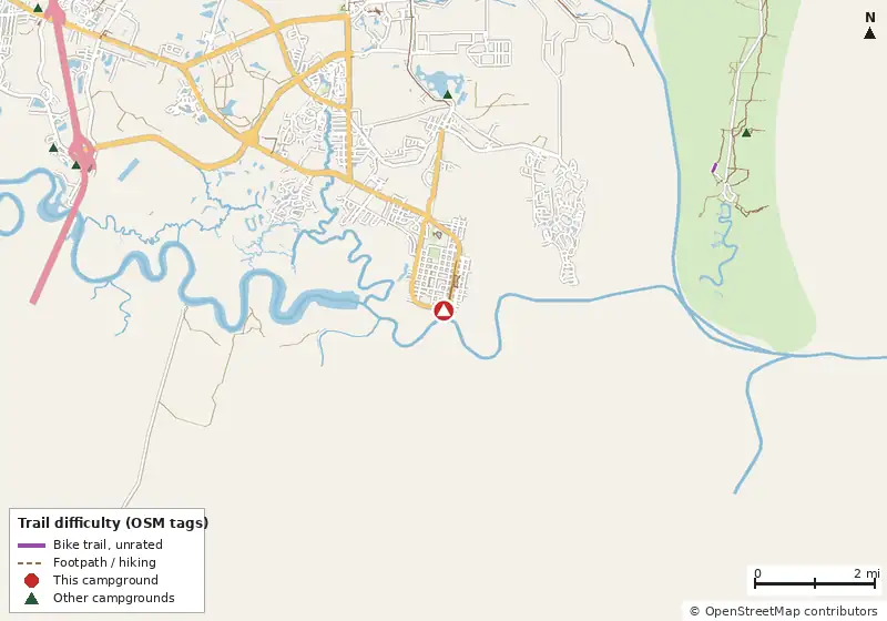 Map of roads, water and trails within about 5 miles of Cumberland Island National Seashore Camping Permits, with bike trails colored by their OpenStreetMap difficulty tags