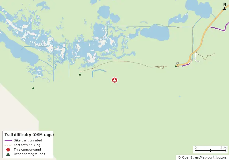 Map of roads, water and trails within about 5 miles of East Clubhouse Beach Campsite, with bike trails colored by their OpenStreetMap difficulty tags