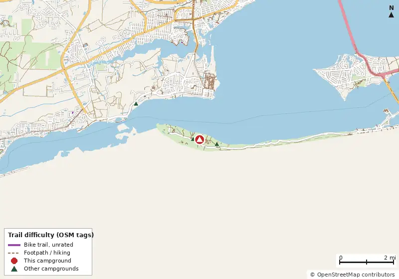 Map of roads, water and trails within about 5 miles of Fort Pickens Campground, with bike trails colored by their OpenStreetMap difficulty tags