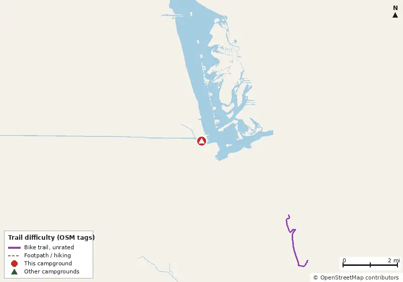 Map of roads, water and trails within about 5 miles of Fort Pierce Downtown KOA Journey, with bike trails colored by their OpenStreetMap difficulty tags