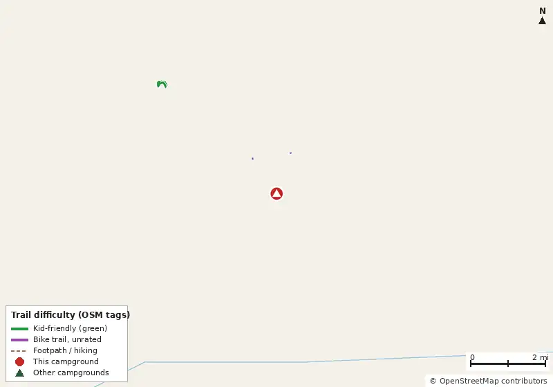 Map of roads, water and trails within about 5 miles of Fred Gannon Rocky Bayou State Park Campground, with bike trails colored by their OpenStreetMap difficulty tags