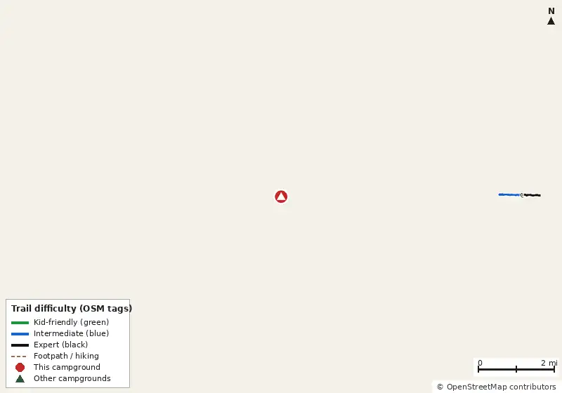 Map of roads, water and trails within about 5 miles of Group Camping, with bike trails colored by their OpenStreetMap difficulty tags