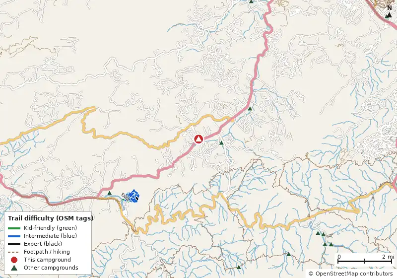 Map of roads, water and trails within about 5 miles of Honeysuckle Meadows RV Park, with bike trails colored by their OpenStreetMap difficulty tags