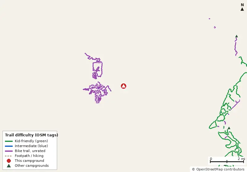 Map of roads, water and trails within about 5 miles of Indian Springs State Park Campground, with bike trails colored by their OpenStreetMap difficulty tags