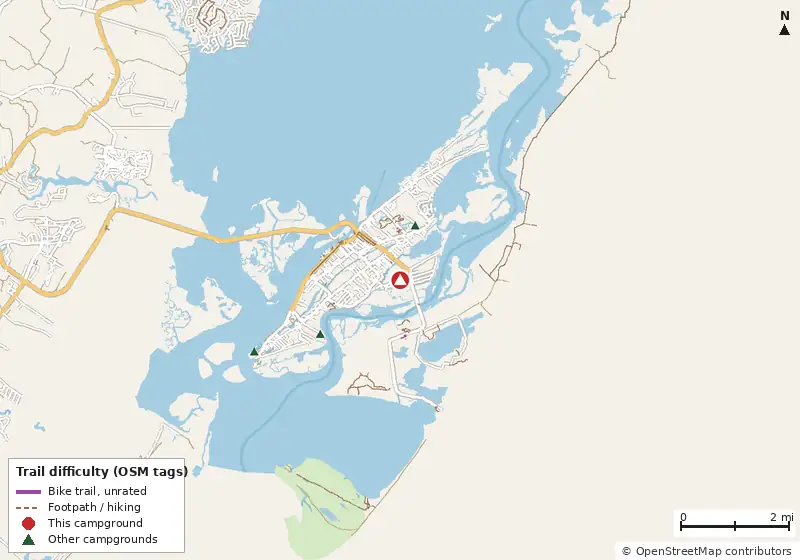 Map of roads, water and trails within about 5 miles of Jellystone Park Chincoteague Island, with bike trails colored by their OpenStreetMap difficulty tags