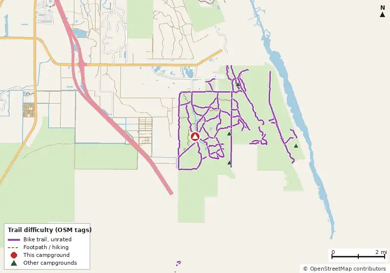 Map of roads, water and trails within about 5 miles of Kitching Creek Primitive Camp, with bike trails colored by their OpenStreetMap difficulty tags