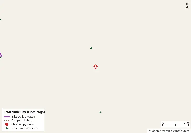 Map of roads, water and trails within about 5 miles of Koreshan State Park Campground, with bike trails colored by their OpenStreetMap difficulty tags