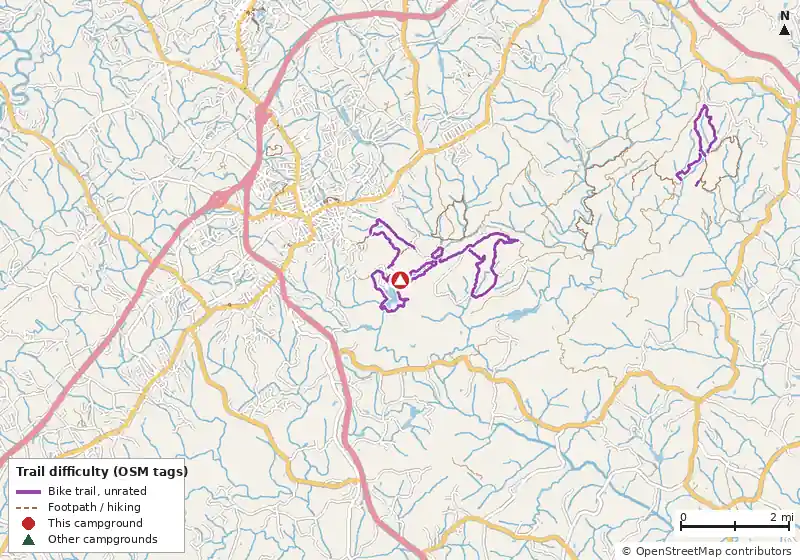 Map of roads, water and trails within about 5 miles of Lake Russell Recreation Area, with bike trails colored by their OpenStreetMap difficulty tags