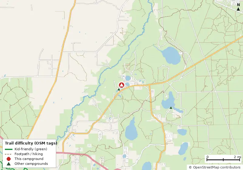 Map of roads, water and trails within about 5 miles of Lake Shore Group Camp, with bike trails colored by their OpenStreetMap difficulty tags