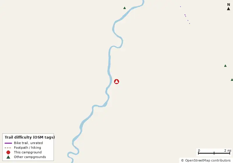 Map of roads, water and trails within about 5 miles of Manatee Springs State Park Campground, with bike trails colored by their OpenStreetMap difficulty tags