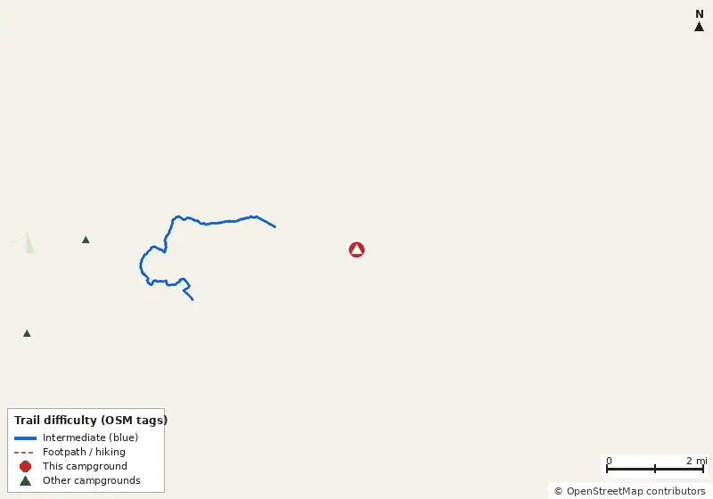 Map of roads, water and trails within about 5 miles of Mike Roess Gold Head Branch State Park Campground, with bike trails colored by their OpenStreetMap difficulty tags