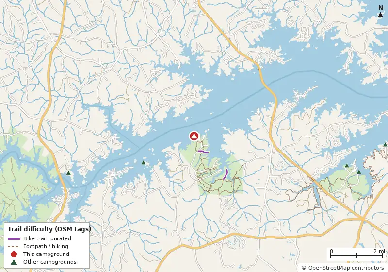 Map of roads, water and trails within about 5 miles of Mistletoe State Park Campground, with bike trails colored by their OpenStreetMap difficulty tags