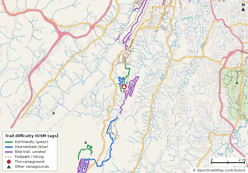 Map of roads, water and trails within about 5 miles of Moonshine Campsite, with bike trails colored by their OpenStreetMap difficulty tags
