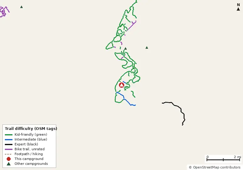 Map of roads, water and trails within about 5 miles of Ocmulgee Flats Camp, with bike trails colored by their OpenStreetMap difficulty tags