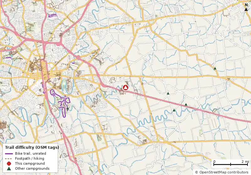 Map of roads, water and trails within about 5 miles of Old Mill Stream Campground, with bike trails colored by their OpenStreetMap difficulty tags