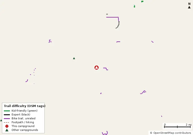 Map of roads, water and trails within about 5 miles of Orange Grove Campround and RV Park, with bike trails colored by their OpenStreetMap difficulty tags