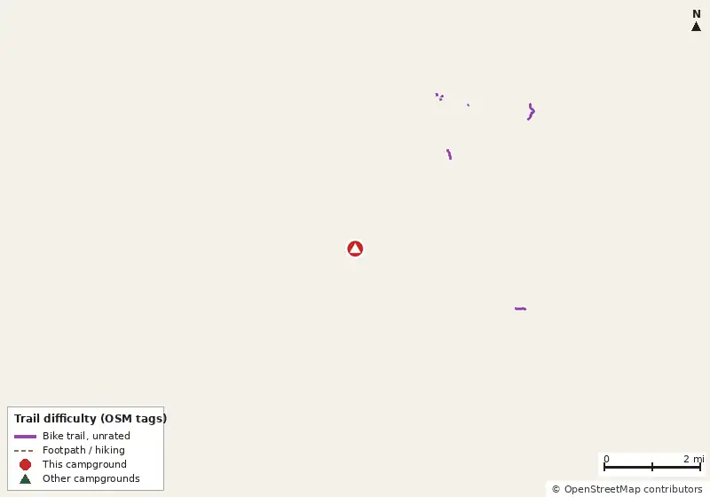 Map of roads, water and trails within about 5 miles of Panola Mountain State Park Campground, with bike trails colored by their OpenStreetMap difficulty tags