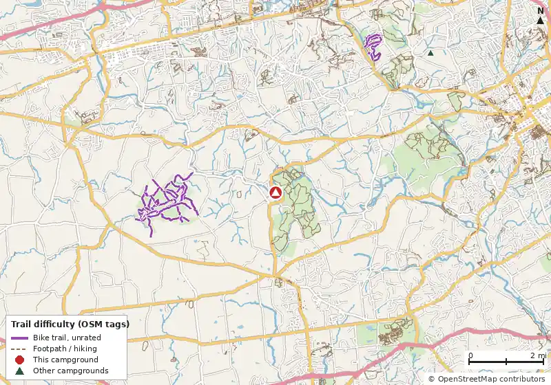 Map of roads, water and trails within about 5 miles of Philadelphia/West Chester KOA Holiday, with bike trails colored by their OpenStreetMap difficulty tags
