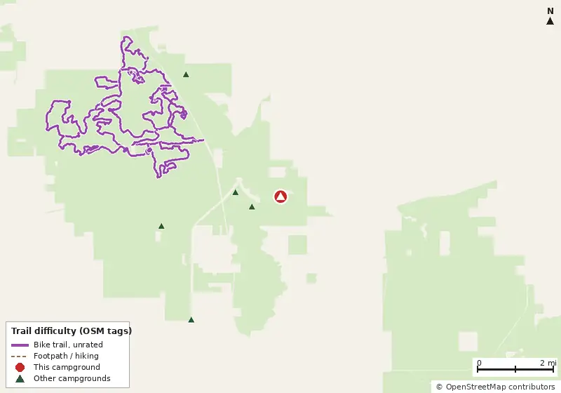 Map of roads, water and trails within about 5 miles of River Junction Campground, with bike trails colored by their OpenStreetMap difficulty tags
