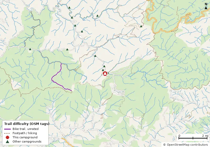Map of roads, water and trails within about 5 miles of Rough Ridge Campground, with bike trails colored by their OpenStreetMap difficulty tags
