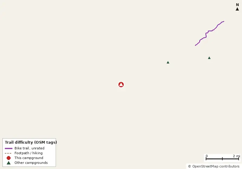 Map of roads, water and trails within about 5 miles of Ruth B. Kirby Gilchrist Blue Springs State Park Campground, with bike trails colored by their OpenStreetMap difficulty tags