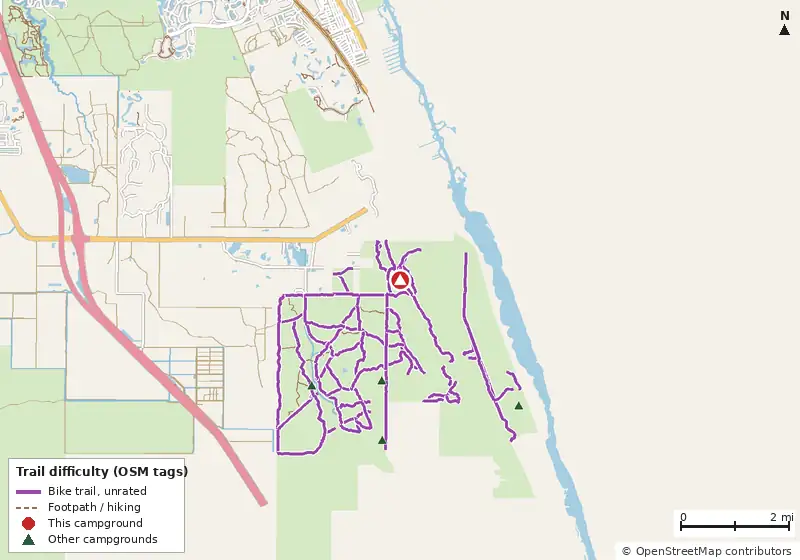 Map of roads, water and trails within about 5 miles of Scrub Jay Primitive Camp, with bike trails colored by their OpenStreetMap difficulty tags