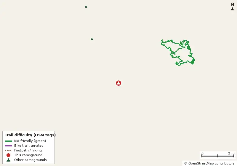 Map of roads, water and trails within about 5 miles of Seven Springs Travel Park, with bike trails colored by their OpenStreetMap difficulty tags