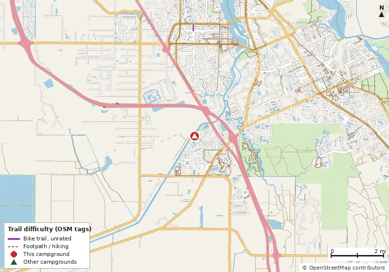 Map of roads, water and trails within about 5 miles of St Lucie South, with bike trails colored by their OpenStreetMap difficulty tags