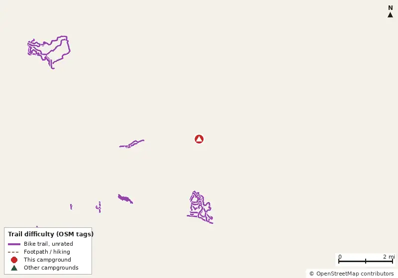 Map of roads, water and trails within about 5 miles of Tallahassee RV Park, with bike trails colored by their OpenStreetMap difficulty tags