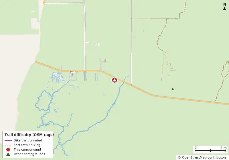 Map of roads, water and trails within about 5 miles of Trail Lakes Campgrounds, with bike trails colored by their OpenStreetMap difficulty tags