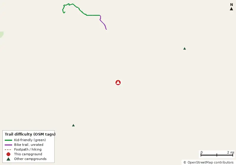 Map of roads, water and trails within about 5 miles of Wakulla River Campsite, with bike trails colored by their OpenStreetMap difficulty tags