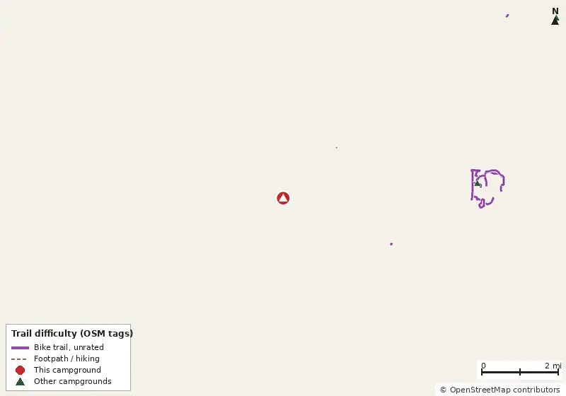 Map of roads, water and trails within about 5 miles of West, with bike trails colored by their OpenStreetMap difficulty tags