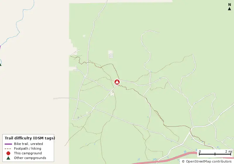Map of roads, water and trails within about 5 miles of west tower hunt, with bike trails colored by their OpenStreetMap difficulty tags