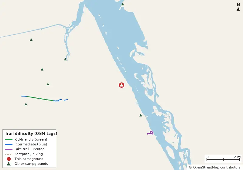 Map of roads, water and trails within about 5 miles of Whispering Palms, with bike trails colored by their OpenStreetMap difficulty tags