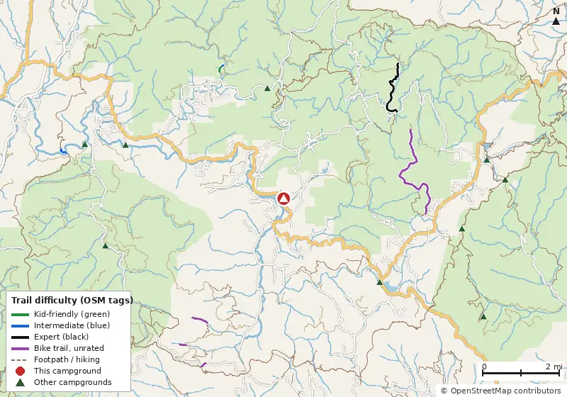 Map of roads, water and trails within about 5 miles of Wildcat Lodge & Campground, with bike trails colored by their OpenStreetMap difficulty tags