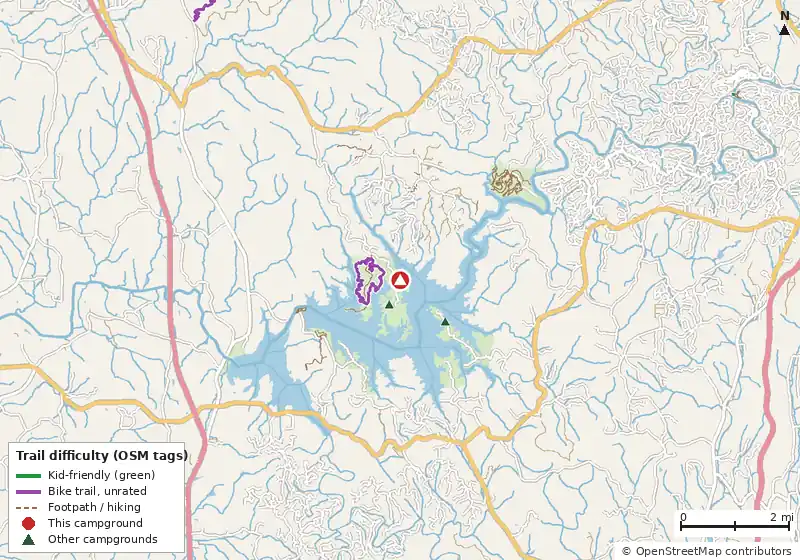 Map of roads, water and trails within about 5 miles of Woodring Branch Primitive Campground, with bike trails colored by their OpenStreetMap difficulty tags